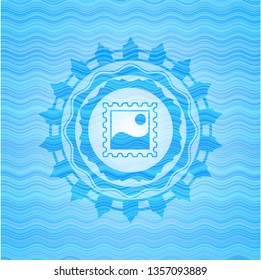 picture icon inside water wave concept badge.