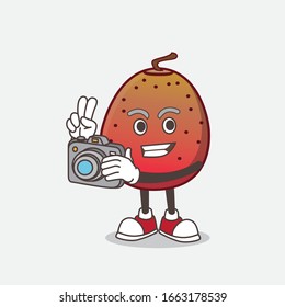 A picture of Indian Fig cartoon mascot character as photographer in action with a camera