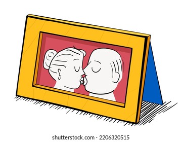 Picture of a kissing couple in a wooden frame