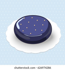Picture of mousse cake with fruit filling decorated by gold balls on the  glossy glaze.The cake is on the blue polka dotted background.