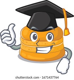 A picture of orange macaron with black hat for graduation ceremony