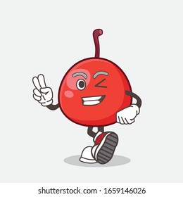 A picture of Red Berry cartoon mascot character with two fingers