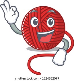 A picture of red wool yarn making an Okay gesture