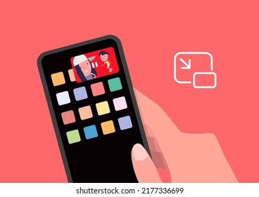 Picture-in-picture (PIP) mode on mobile. Hand holding mobile phone.