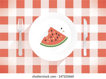  Piece of fresh watermelon on the plate with fork and knife on the beautiful tablecloth.