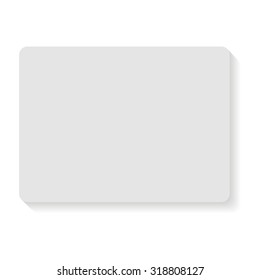 piece of paper hanging on the wall with shadow