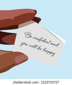Piece of paper with text on it including happiness holded by a women