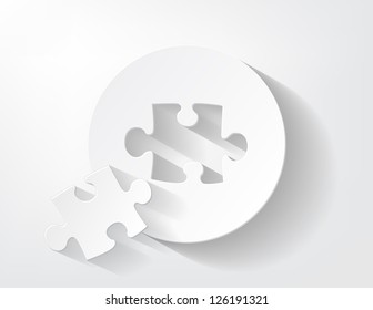 Piece of puzzle cut out from a piece of paper with a nice shadow.