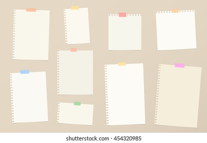 Pieces of brown cutout notebook paper are stuck with colorful sticky tape on background