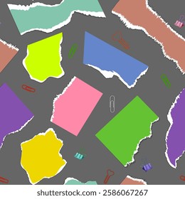 Pieces of colored paper on a dark background and stationery in the form of a pattern