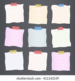 Pieces of crumpled cut colorful lined note paper are stuck on dark gray background