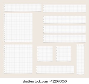 Pieces of cut out white squared notebook paper are stuck on light  brown background