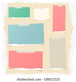 Pieces of different size colorful note, notebook, copybook sheets stuck with sticky tape on ripped paper