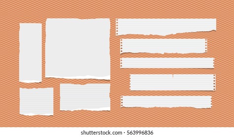 Pieces of ripped ruled different size white note, notebook, copybook paper sheets, strips stuck on squared orange background