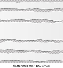 Pieces of ripped white blank note, notebook paper strips stuck on gray squared background