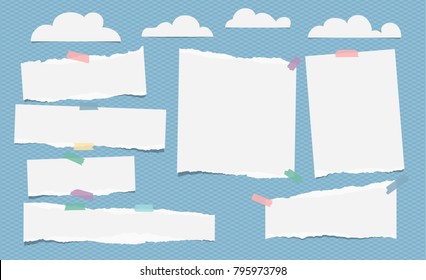 Pieces of ripped white blank note, notebook paper with clouds on blue background