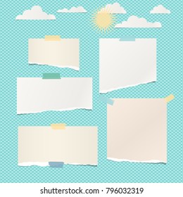 Pieces of ripped white blank note, notebook paper with clouds and sun on turquoise background