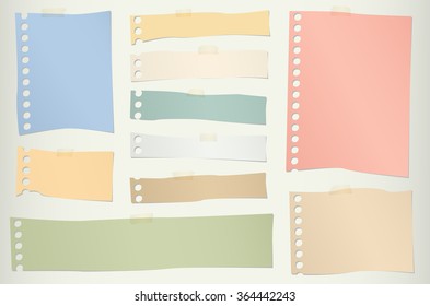 Pieces of torn colorful blank note paper with adhesive tape