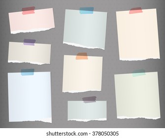 Pieces of torn colorful blank note paper on gray background - Shutterstock ID 378050305