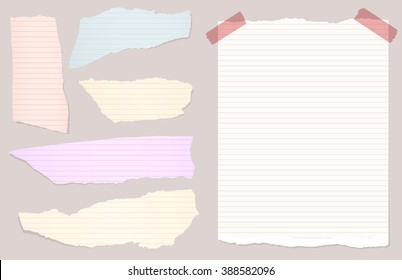 Pieces of torn colorful lined notebook, note paper