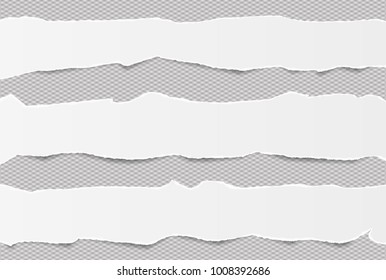 Pieces of torn white blank note, notebook paper strips stuck on gray squared background
