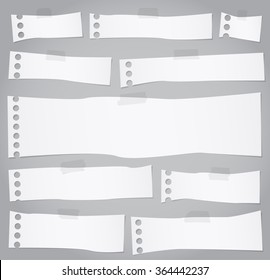Pieces of torn white blank note paper with adhesive tape
