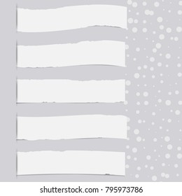 Pieces of torn white blank note, notebook strips inserted into gra cut paper with dots.