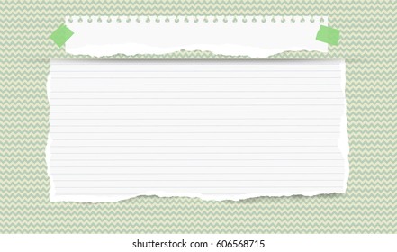 Pieces of torn white blank and ruled note, copybook, notebook strip, sheet inserted into waved green cut paper pattern