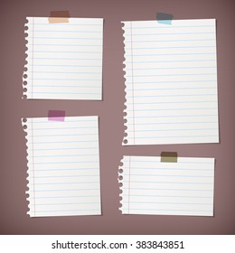 Pieces of torn white lined note paper on brown background