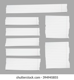 Pieces of torn white lined note paper are stuck on gray background