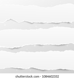 Pieces of torn white note, notebook paper strips stuck on gray background with stars pattern