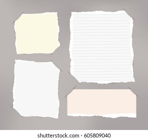 Pieces of torn white, pastel blank and ruled note copybook, notebook sheets inserted into cut paper