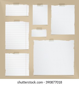 Pieces of torn white squared and lined notebook paper with sticky tape on brown striped background