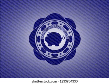 piggy bank icon inside badge with jean texture