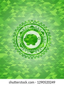 piggy bank icon inside green emblem with triangle mosaic background