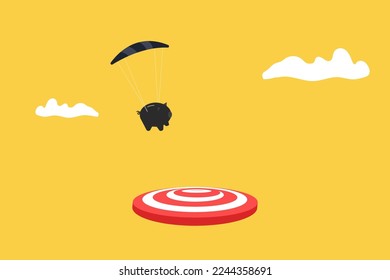 piggy bank with parachute landing on the target. concept of goal, opportunity and success