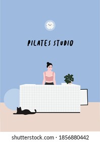 A pilates studio - a woman standing at a counter