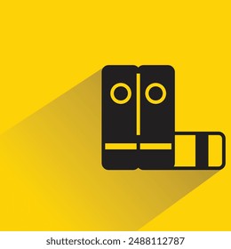 pile of books icon with shadow on yellow background