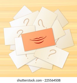 Pile of cards with question sign and one card with smile sign