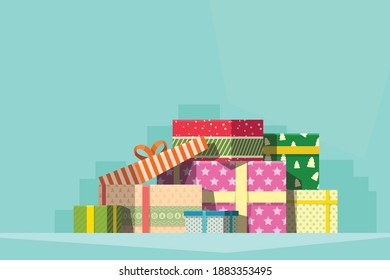 pile of colorful christmas gifts on blue