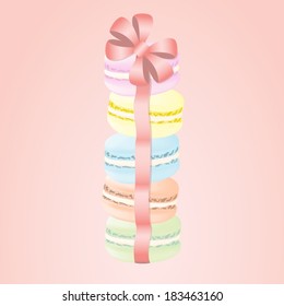 Pile of tasty colourful macaroons with ribbon