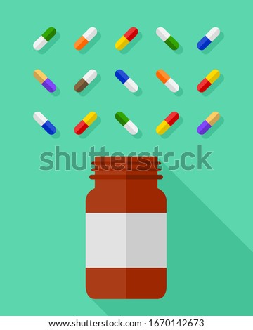 Pill bottle and an assortment of multicolor pills and capsules beautifully arranged on green background. Medicine and medication concept in flat design.