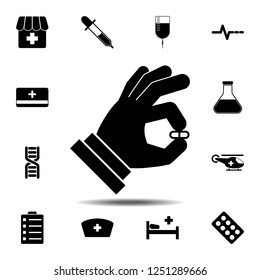The Pill in the hand icon. Simple glyph vector element of Medecine set icons for UI and UX, website or mobile application