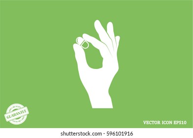 Pill in the hand icon vector illustration eps10.