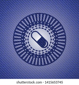 pill icon inside badge with denim background