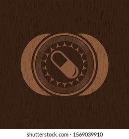 pill icon inside badge with wood background