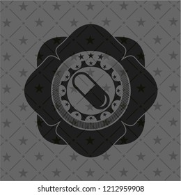 pill icon inside black badge