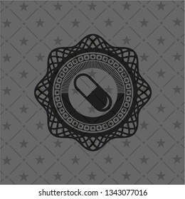 pill icon inside black badge