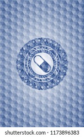 pill icon inside blue polygonal emblem.