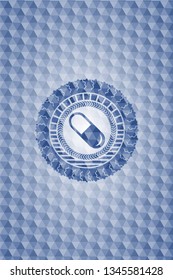 pill icon inside blue polygonal emblem.